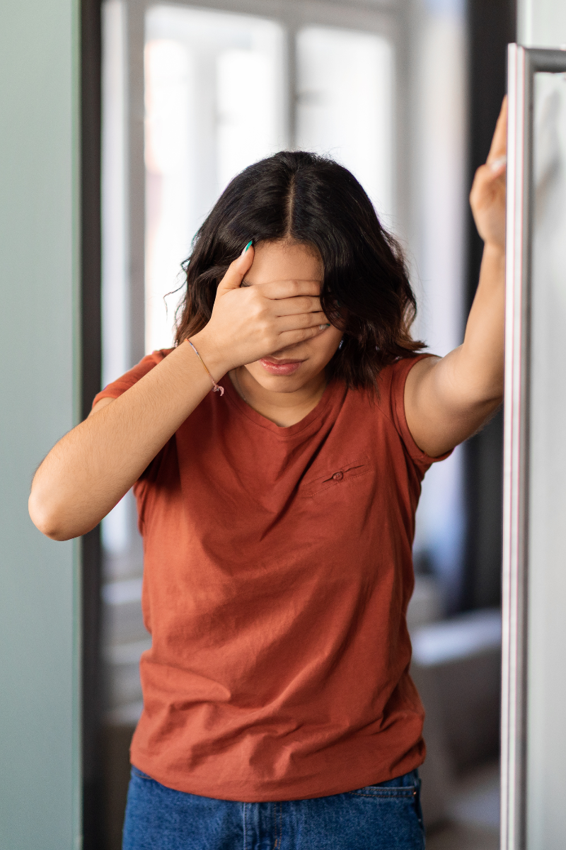 A woman experiencing dizziness.